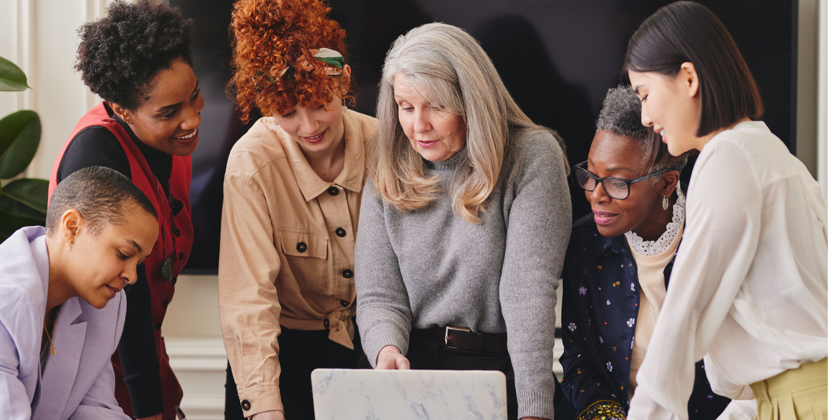 Mature 50+ woman leading a discussion with other women